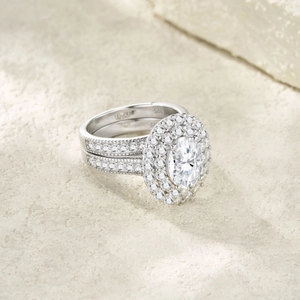 Detail view of S925 sterling silver ring with oval moissanite and double halo setting