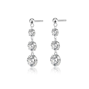 Macro shot of S925 silver earrings featuring three graduated round brilliant moissanite stones