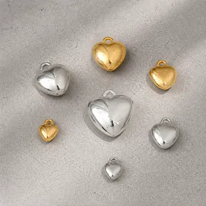 Macro shot of gold and silver heart pendants in various sizes for DIY jewelry crafts