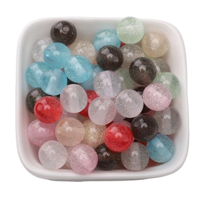 Mix of 8-10mm resin glitter round beads for DIY jewelry making in a white ceramic bowl