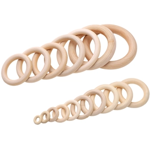 Polished natural wood rings in various sizes for DIY jewelry and handicraft projects