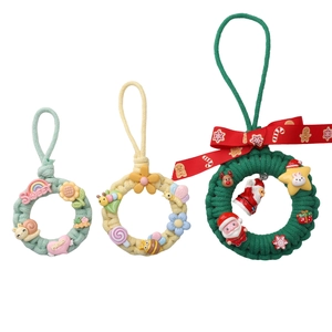 Three sizes of handcrafted woven wooden ring pendants with colorful resin charms and bows