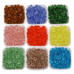 Macro view of multi-colored faceted cube glass beads for DIY jewelry making and crafts