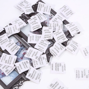 Bulk packs of white silica gel desiccant packets for jewelry moisture prevention