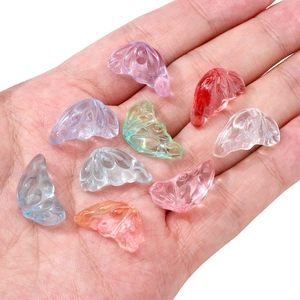 Colorful 11x20mm glass wing beads for DIY jewelry making displayed on a palm