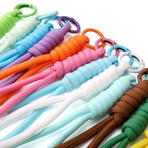 Detailed close-up of colorful braided paracord keychains with matching metal spring rings