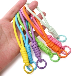 Colorful handmade paracord keychains with metal spring rings in seven assorted vibrant colors