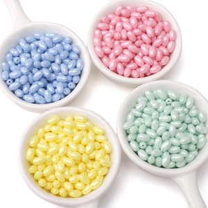 Macro detail of pearlescent macaron-colored glass beads for DIY bracelet and necklace making