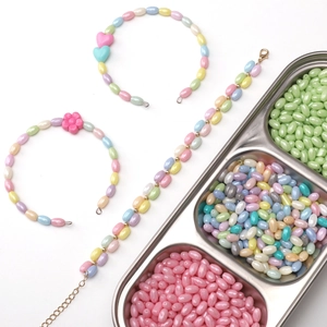 Macro shot of macaron color cream finish glass beads and DIY floral jewelry accessories