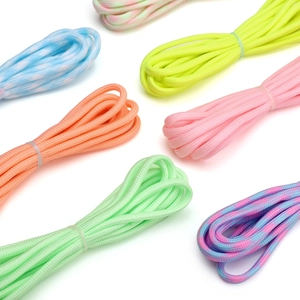 Close-up of colorful 7-strand luminous paracord bundles for DIY bracelet jewelry making