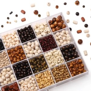 Dark natural wood beads assortment in transparent organizer box for DIY jewelry making