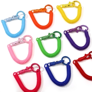 Set of nine colorful plastic spiral spring keychains with matching metal lobster clasps
