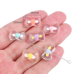 Detail showing 16mm cartoon bow acrylic beads with heart center for DIY jewelry making