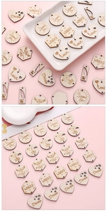 Macro view of assorted laser-cut wooden DIY charms with engraved inspirational quotes