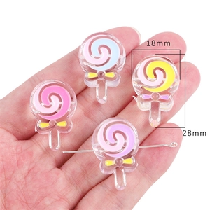 Close-up of 18x28mm acrylic lollipop beads with spiral texture and cute bow details