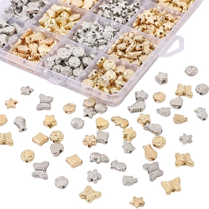 DIY jewelry making kit with gold and silver beads in turtle, owl, and shell shapes