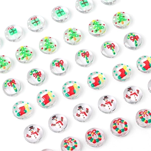 Detailed view of transparent Christmas DIY beads with snowman and wreath painted motifs