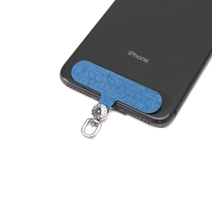 Blue oxford cloth phone lanyard patch with silver 360 degree rotating metal ring on a phone