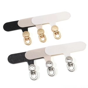 Detail view of Oxford fabric phone lanyard patches with gold and silver D-rings in multiple colors