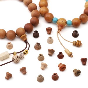 Assorted wooden beads and spacers for DIY jewelry making in various natural wood colors