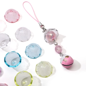 Detailed macro view of acrylic jellyfish bell charms with DIY handmade beads and ornaments
