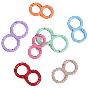 Detailed view of colorful 8-shaped alloy carabiner hooks in 7 vibrant painted finishes