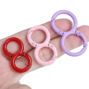 Set of colorful figure-8 alloy spring buckles in red pink and purple for DIY keychains