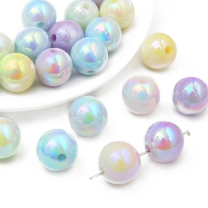 Macro shot of 16mm iridescent acrylic beads with neon coating for DIY jewelry making
