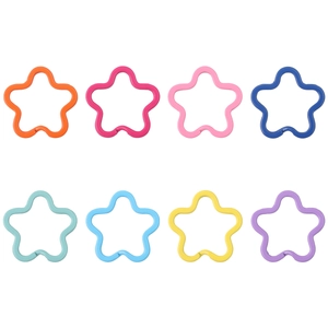 Close-up of star-shaped colorful painted iron rings for DIY jewelry and keychain making