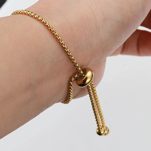 Adjustable golden box chain bracelet with slider clasp and silicone positioning beads
