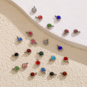 Macro detail of colorful 6mm birthstone charms with stainless steel settings for DIY jewelry