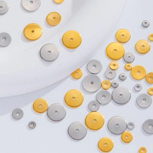Macro shot of 18K gold and silver stainless steel spacer beads for DIY jewelry making