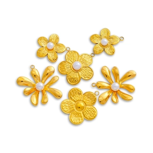 Detailed view of 18K gold plated floral pendants with pearls for DIY jewelry making