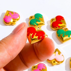 Handheld gold stainless steel heart pendant with vibrant red enamel for DIY jewelry making