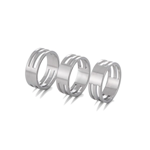 Detailed macro view of three high-polished stainless steel open jump ring jewelry tools