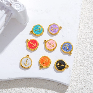 Macro detail of 18k gold-plated enamel anchor charms for DIY jewelry making sets