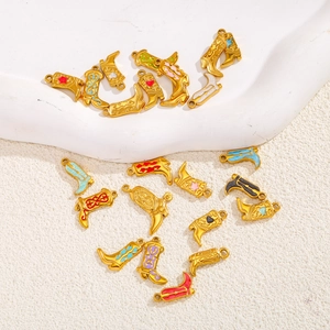 Detail of colorful 18K gold plated cowboy boot charms with heart and star patterns
