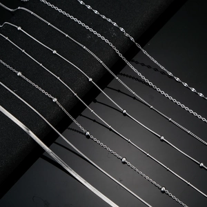 Macro detail of various stainless steel snake and bead chains for DIY jewelry making