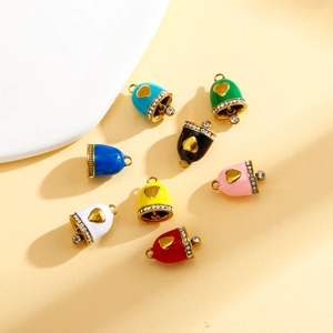 Macro shot of colorful enamel heart bell charms with sparkling zircon stone details
