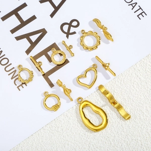 Detailed macro view of various gold-plated stainless steel OT toggle clasps for DIY jewelry