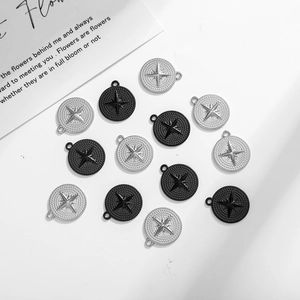 Detailed view of stainless steel compass star pendants in black and silver for jewelry making