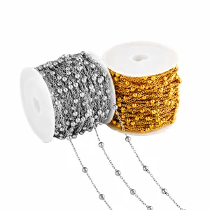 Detail of silver and gold beaded chains on reels for DIY jewelry making and crafting