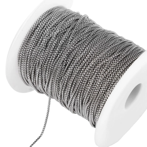 Detailed view of 1.8mm stainless steel box chain wound on a spool for DIY jewelry