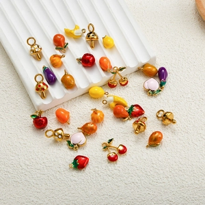 Detail of colorful fruit pendants like strawberry and cherry for DIY jewelry making