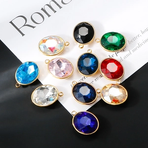 Macro view of colorful faceted glass pendants with 18K gold plated stainless steel edges
