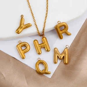 Mini gold bubble initial pendants in 18K plated stainless steel with matching chain