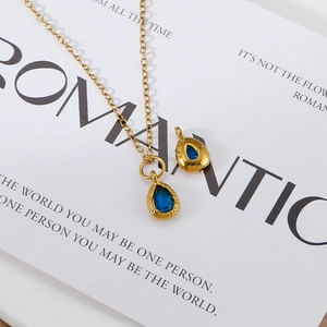 18K gold plated stainless steel teardrop necklace with blue stone and hammered texture