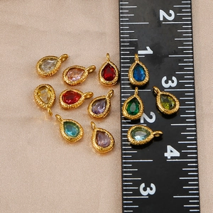 Colorful teardrop gemstone charms in 18K gold-plated stainless steel with size ruler