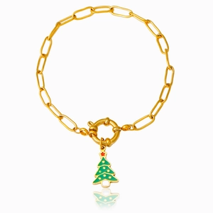 Gold paperclip chain bracelet with a green enamel Christmas tree charm and OT clasp
