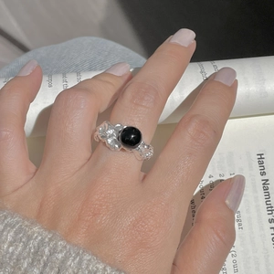 Detailed shot of S925 sterling silver ring with irregular texture and black agate stone